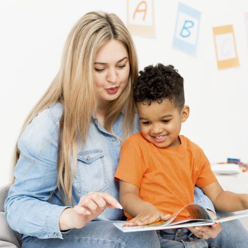woman-young-boy-looking-home (1)